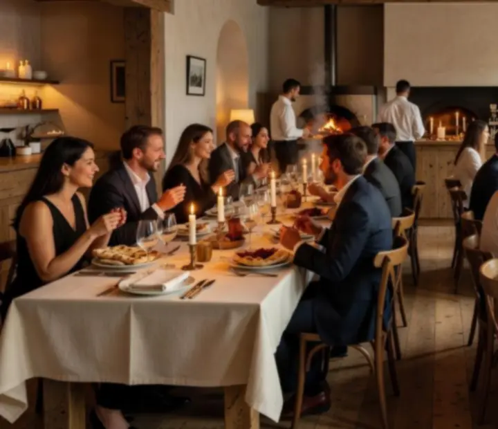 A softly lit banquet room with long tables set for an evening woodfired dinner.